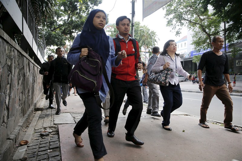 Several explosions went off and gunfire broke out in the center of the Indonesian capital on Thursday and police said they suspected a suicide bomber was responsible for at least one the blasts. Bombs at Indonesian capital,gunfire at Indonesian capital,Bombs and gunfire rock Indonesian capital,explosions,Jakarta attacks,gunfire,suicide bomber