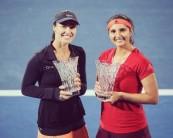 Indo-Swiss pair Sania Mirza and Martina Hingis lift Sydney International women's doubles title.