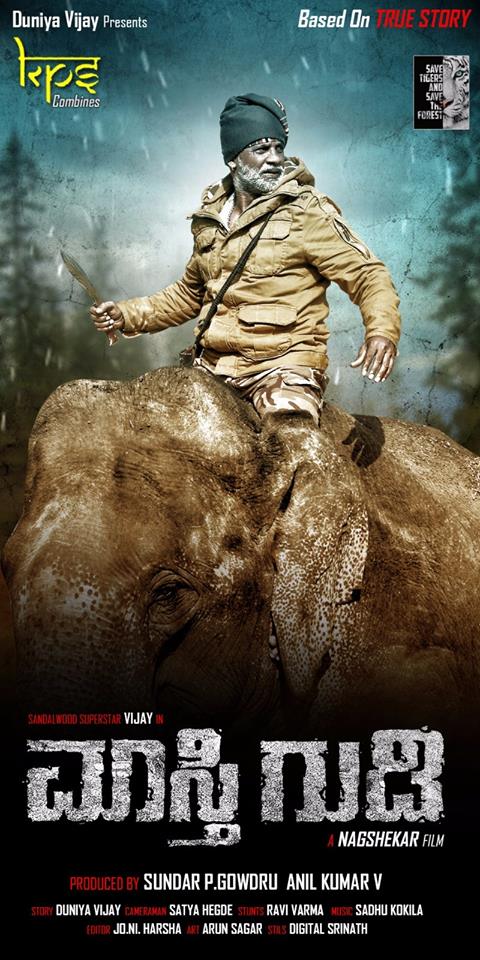 Motion poster of Duniya Vijay's 'Maasthi Gudi' has been revealed on the occasion of Duniya Vijay's birthday on 20 January. Duniya Vijay,Duniya Vijay Maasthi Gudi first look poster,Maasthi Gudi first look poster,Maasthi Gudi first look,Maasthi Gudi poster,Duniya Vijay birthday,kannada movie Maasthi Gudi,Maasthi Gudi movie stills,Maasthi Gudi movie pics,Maasthi Gudi movie image