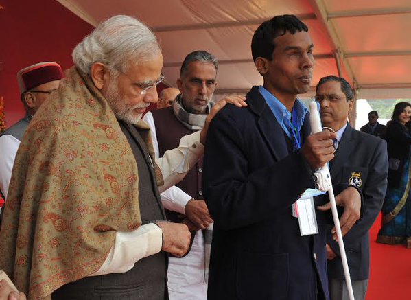 Prime Minister Narendra Modi on Friday set a record of sorts by distributing 15,746 special aid equipment to 9,296 differently-abled people here. Prime Minister Narendra Modi,Narendra Modi,modi,differently-abled people,Thawar Chand Gehlot,special aid equipment