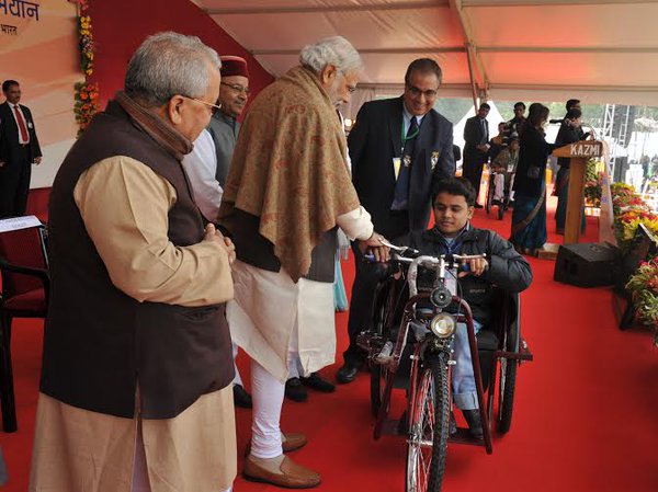 Prime Minister Narendra Modi on Friday set a record of sorts by distributing 15,746 special aid equipment to 9,296 differently-abled people here. Prime Minister Narendra Modi,Narendra Modi,modi,differently-abled people,Thawar Chand Gehlot,special aid equipment