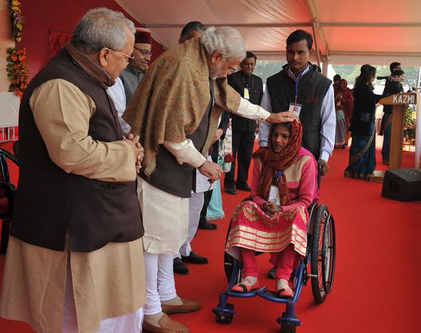 Prime Minister Narendra Modi on Friday set a record of sorts by distributing 15,746 special aid equipment to 9,296 differently-abled people here. Prime Minister Narendra Modi,Narendra Modi,modi,differently-abled people,Thawar Chand Gehlot,special aid equipment