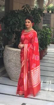 Actress Aishwarya Rai Bachchan has chosen an elegant look in a red designer Banarasi silk sari to wear for a special lunch with French President Francois Hollande on Tuesday.