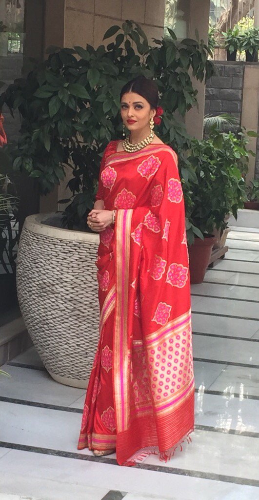 Actress Aishwarya Rai Bachchan has chosen an elegant look in a red designer Banarasi silk sari to wear for a special lunch with French President Francois Hollande on Tuesday. Aishwarya Rai Bachchan,Aishwarya Rai,Aishwarya Rai Bachchan at Hollande Lunch,Hollande Lunch,French President Francois Holland,Aishwarya looks ravishing in red sari for Hollande lunch,Aishwarya in red sari,Actress Aishwarya Rai Bachchan,Aishwarya Rai new