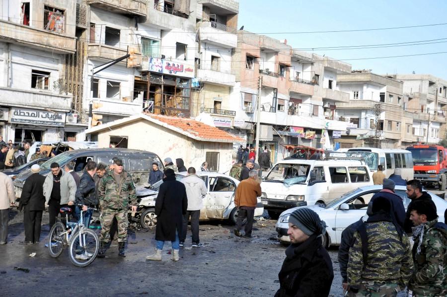 At least 16 people were killed and dozens wounded on Saturday in the central Syrian city of Homs Two bombings rock Syria,Syria,blast in Syria,twin blast in Syria,car-bomb,Syria's central city of Homs,Homs,pro-government district,al-Zahra,Takfiri Daesh terrorist group,Takfiri Daesh