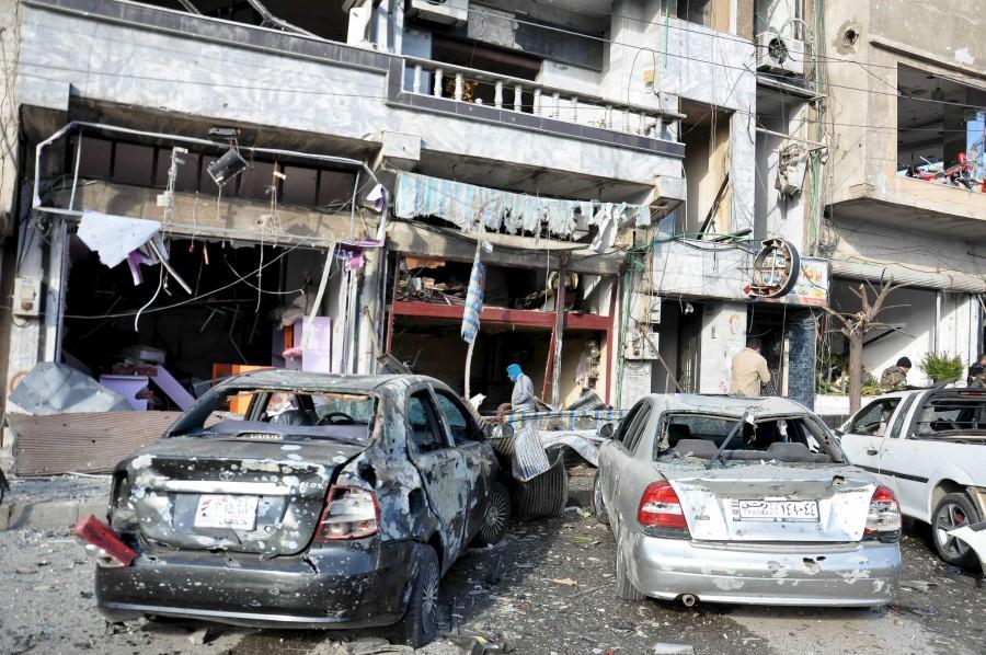 At least 16 people were killed and dozens wounded on Saturday in the central Syrian city of Homs Two bombings rock Syria,Syria,blast in Syria,twin blast in Syria,car-bomb,Syria's central city of Homs,Homs,pro-government district,al-Zahra,Takfiri Daesh terrorist group,Takfiri Daesh