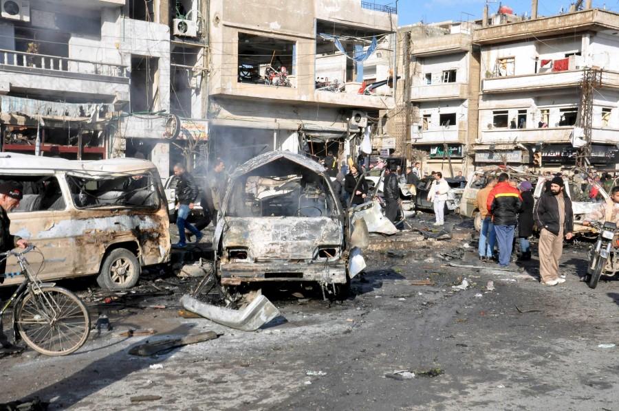 At least 16 people were killed and dozens wounded on Saturday in the central Syrian city of Homs Two bombings rock Syria,Syria,blast in Syria,twin blast in Syria,car-bomb,Syria's central city of Homs,Homs,pro-government district,al-Zahra,Takfiri Daesh terrorist group,Takfiri Daesh
