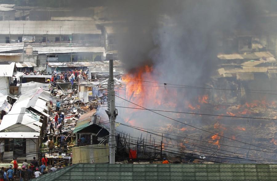 Photos of Fire Rages over Residential Area in Kampung Bandan. Kampung Bandan,Fire at Kampung Bandan,100 wooden dwellings,Indonesia,Residential Area in Kampung Bandan