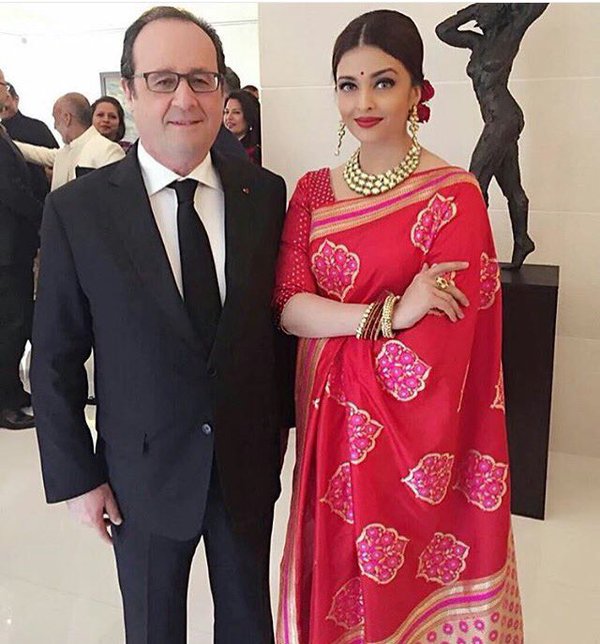 Actress Aishwarya Rai Bachchan has chosen an elegant look in a red designer Banarasi silk sari to wear for a special lunch with French President Francois Hollande on Tuesday. Aishwarya Rai Bachchan,Aishwarya Rai,Aishwarya Rai Bachchan at Hollande Lunch,Hollande Lunch,French President Francois Holland,Aishwarya looks ravishing in red sari for Hollande lunch,Aishwarya in red sari,Actress Aishwarya Rai Bachchan,Aishwarya Rai new