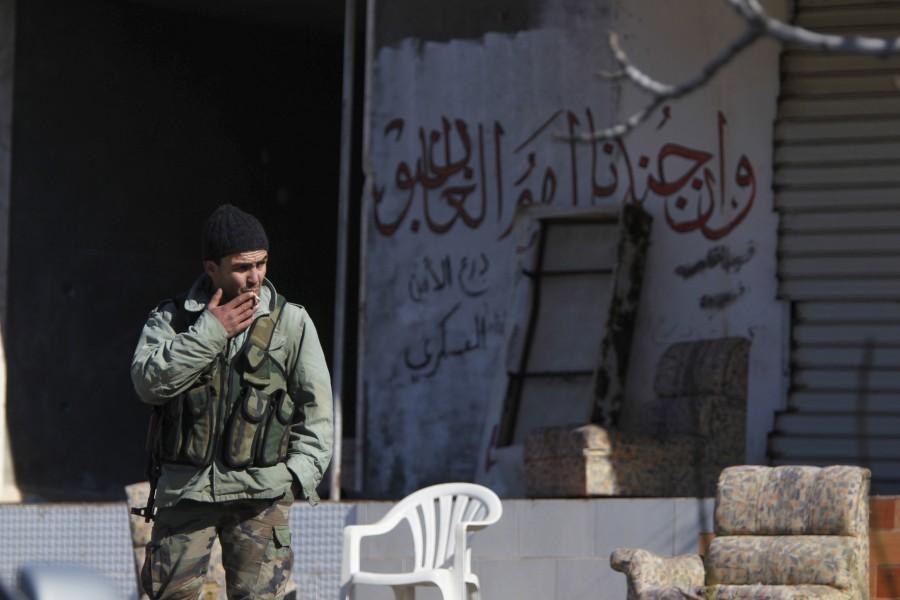 Syrian pro-government forces recapture the rebel-held town of Rabiya, building on battlefield advances in the area ahead of planned peace talks. Syria,Syrian pro-governmen,Rabiya,rebel fighters,Assad forces,Rabiya building