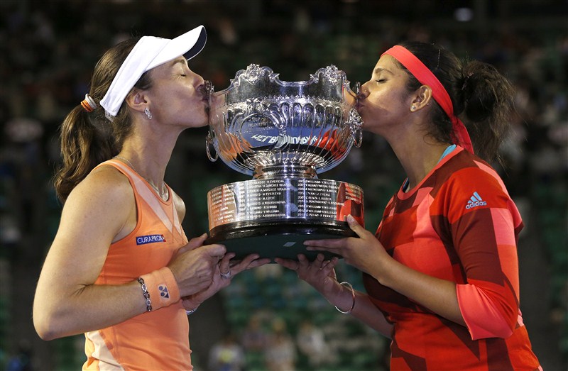 Top seeded women's doubles pair of Sania Mirza and Martina Hingis overwhelmed Czech seventh seeds Andrea Hlavackova and Lucie Hradecka 7-6 (1), 6-3 to win the Australian Open crown here on Friday. Sania Mirza,Martina Hingis,Czech seventh,Andrea Hlavackova,Lucie Hradecka,Sania-Martina win Australian Open women's doubles,Australian Open women's doubles
