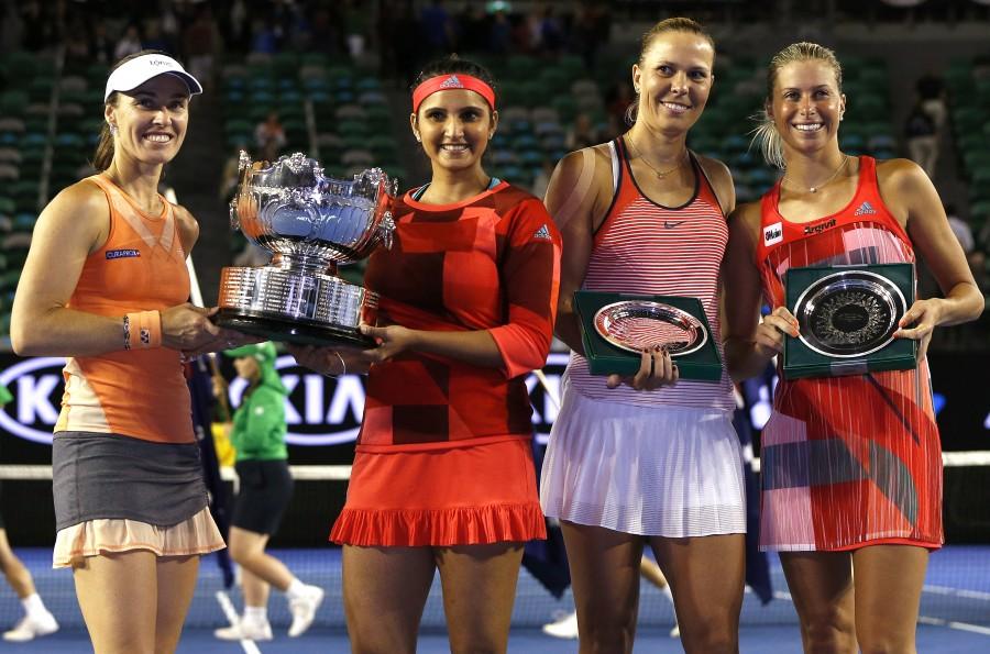 Top seeded women's doubles pair of Sania Mirza and Martina Hingis overwhelmed Czech seventh seeds Andrea Hlavackova and Lucie Hradecka 7-6 (1), 6-3 to win the Australian Open crown here on Friday. Sania Mirza,Martina Hingis,Czech seventh,Andrea Hlavackova,Lucie Hradecka,Sania-Martina win Australian Open women's doubles,Australian Open women's doubles