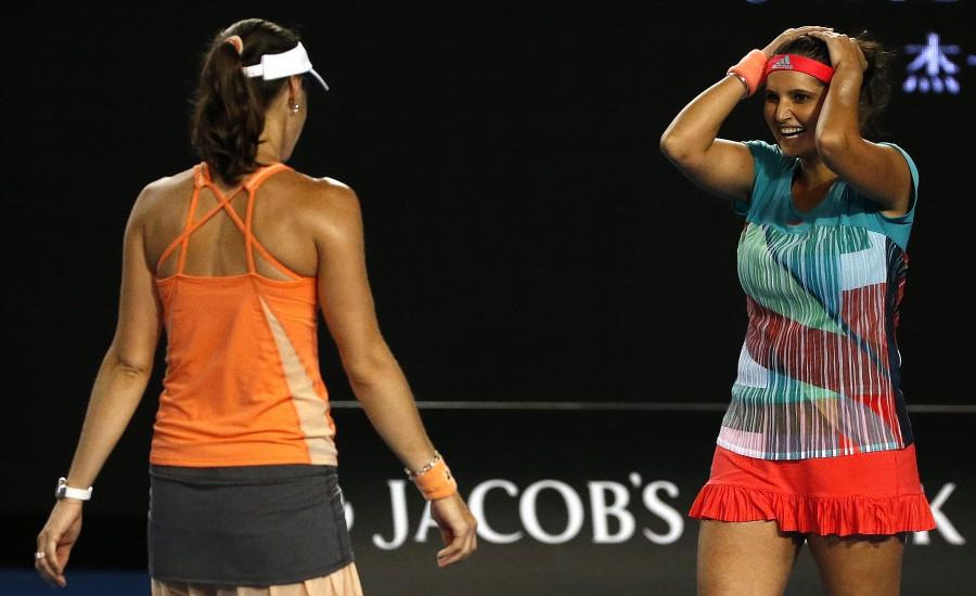 Top seeded women's doubles pair of Sania Mirza and Martina Hingis overwhelmed Czech seventh seeds Andrea Hlavackova and Lucie Hradecka 7-6 (1), 6-3 to win the Australian Open crown here on Friday. Sania Mirza,Martina Hingis,Czech seventh,Andrea Hlavackova,Lucie Hradecka,Sania-Martina win Australian Open women's doubles,Australian Open women's doubles