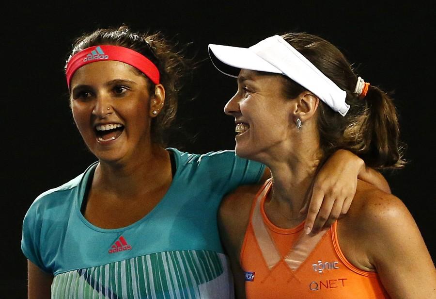 Top seeded women's doubles pair of Sania Mirza and Martina Hingis overwhelmed Czech seventh seeds Andrea Hlavackova and Lucie Hradecka 7-6 (1), 6-3 to win the Australian Open crown here on Friday. Sania Mirza,Martina Hingis,Czech seventh,Andrea Hlavackova,Lucie Hradecka,Sania-Martina win Australian Open women's doubles,Australian Open women's doubles