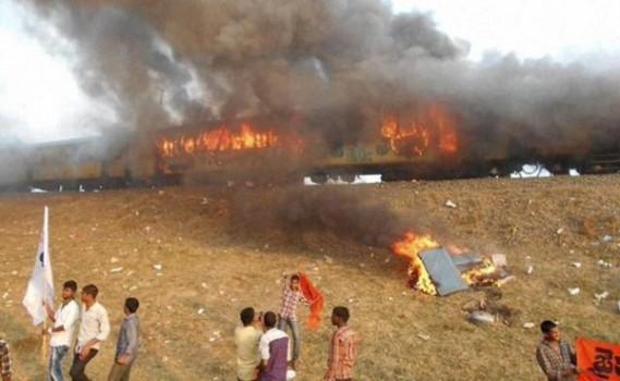 Violence broke out in Andhra Pradesh's East Godavari district on Sunday as thousands of protestors from Kapu caste set afire a train and blocked rail and road traffic.