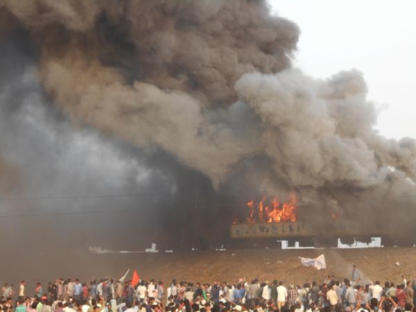 Violence broke out in Andhra Pradesh's East Godavari district on Sunday as thousands of protestors from Kapu caste set afire a train and blocked rail and road traffic. Kapus,Kapu Protesters,Kapu Protesters in Andhra,Andhra Pradesh,East Godavari,Kapu protest for Backward Class,train set on fire,Tuni in flames,Andhra Kapu quota stir takes violent,Violent Quota Protests In Andhra Pradesh