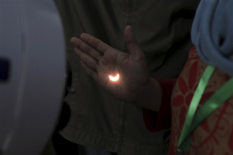 A diamond ring solar eclipse is seen from Matantimali, Palu, Central Sulawesi, Indonesia, India. Solar Eclipse,Solar Eclipse 2016,partial solar eclipse,Partial solar eclipse in India,Solar eclipse in India,solar eclipse in IndiIndonesia,solar eclipse around worls,Solar Eclipse rare pics,Solar Eclipse rare images,Solar Eclipse rare stills,Solar Eclips