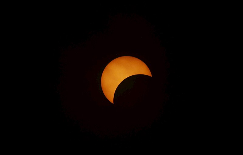 A diamond ring solar eclipse is seen from Matantimali, Palu, Central Sulawesi, Indonesia, India. Solar Eclipse,Solar Eclipse 2016,partial solar eclipse,Partial solar eclipse in India,Solar eclipse in India,solar eclipse in IndiIndonesia,solar eclipse around worls,Solar Eclipse rare pics,Solar Eclipse rare images,Solar Eclipse rare stills,Solar Eclips