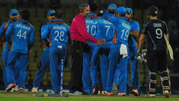 Afghanistan defeated Scotland by 14 runs in the second match of the opening day of the World T20 against Scotland at the Vidarbha Cricket Association Stadium on Tuesday.