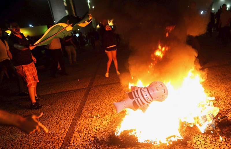 Protests erupted in several Brazilian cities on Wednesday after President Dilma Rousseff named her predecessor Luiz Inacio Lula da Silva chief of staff and a taped conversation fed opposition claims the move was meant to shield Lula from prosecution. Brazilians protest after Lula,Brazilians protest,President Dilma Rousseff,Luiz Inacio Lula da Silva,5,000 demonstrators,demonstrators,Congress building,Anti-government
