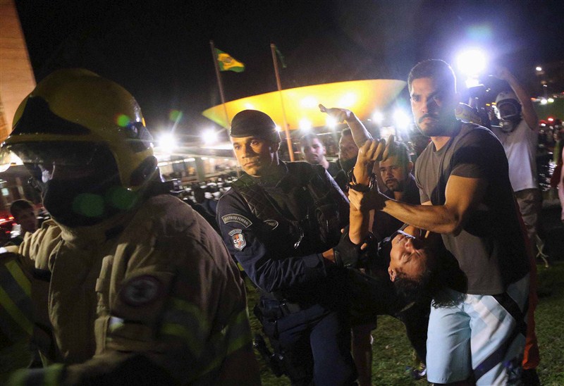 Protests erupted in several Brazilian cities on Wednesday after President Dilma Rousseff named her predecessor Luiz Inacio Lula da Silva chief of staff and a taped conversation fed opposition claims the move was meant to shield Lula from prosecution. Brazilians protest after Lula,Brazilians protest,President Dilma Rousseff,Luiz Inacio Lula da Silva,5,000 demonstrators,demonstrators,Congress building,Anti-government