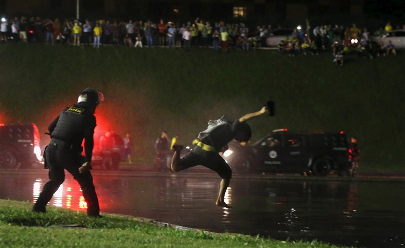 Protests erupted in several Brazilian cities on Wednesday after President Dilma Rousseff named her predecessor Luiz Inacio Lula da Silva chief of staff and a taped conversation fed opposition claims the move was meant to shield Lula from prosecution. Brazilians protest after Lula,Brazilians protest,President Dilma Rousseff,Luiz Inacio Lula da Silva,5,000 demonstrators,demonstrators,Congress building,Anti-government