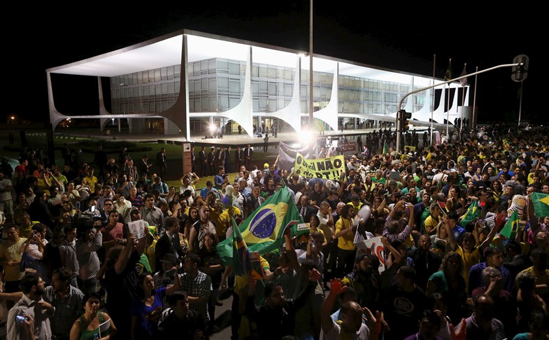Protests erupted in several Brazilian cities on Wednesday after President Dilma Rousseff named her predecessor Luiz Inacio Lula da Silva chief of staff and a taped conversation fed opposition claims the move was meant to shield Lula from prosecution. Brazilians protest after Lula,Brazilians protest,President Dilma Rousseff,Luiz Inacio Lula da Silva,5,000 demonstrators,demonstrators,Congress building,Anti-government
