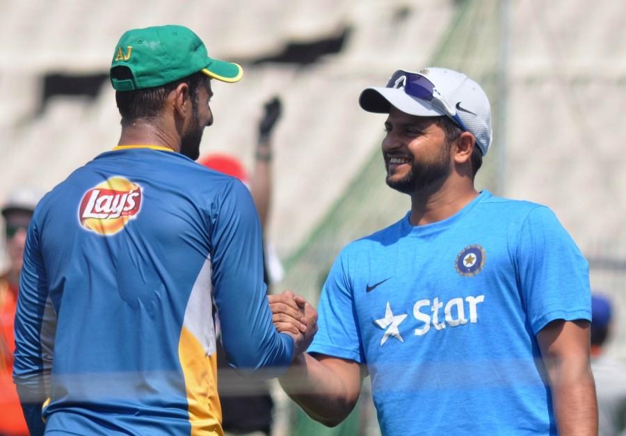 Suresh Raina and Ajinkya Rahane during a practice session at Eden Gardens ahead of their ICC T20 World Cup match in Kolkata, on March 17, 2016. India vs Pakistan,India v Pakistan,Pakistan vs India,Pakistan v India,India vs Pakistan World T20,Suresh Raina,Ajinkya Rahane,ICC T20 World Cup match,ICC World T20 2016,ICC World T20,India vs Pakistan in ICC World T20 2016,India vs Pakistan ICC World T20