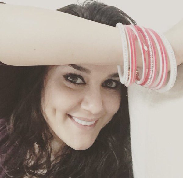 Bollywood actress Preity Zinta, who married American beau Gene Goodenough last month, shared an image of herself in a 'choora' (red and white bangles, denoting a newly married woman in Hinduism in North India) on social media. Preity Zinta,Preity Zinta marriage,Preity Zinta wedding,Preity Zinta marriage pics,Preity Zinta marriage images,Preity Zinta marriage stills,Preity Zinta marriage pictures,Preity Zinta marriage photos,Preity Zinta wedding pics,Preity Zinta wedding images