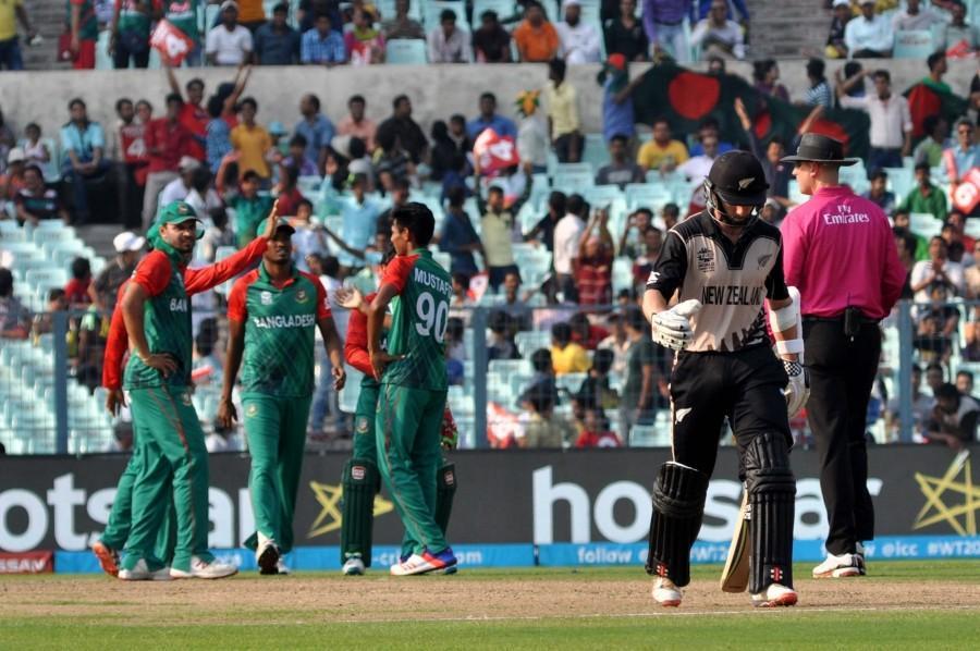 New Zealand put on an impressive show with the ball to skittle out Bangladesh for 70 in 15.4 overs to notch a 75-run win in a floodlight malfunction-interrupted World Twenty20 Group 2 encounter at the Eden Gardens on Saturday. New Zealand beat Bangladesh,New Zealand vs Bangladesh,New Zealand v Bangladesh,New Zealand in Semis,World T20,ICC World T20 2016,World T20 pics,World T20 images,World T20 stills,World T20 pictures