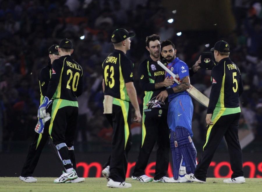 Virat Kohli led the way with a sublime half-century as India defeated Australia by six wickets at the Punjab Cricket Association Stadium here on Sunday to enter the World Twenty20 semi-finals. India beat Australia,India vs Australia,India v Australia,India enter World T20 semis,India World T20 semis,World T20 semis,World T20,World T20 2016,India vs Australia pics,India vs Australia images,India vs Australia stills,India vs Australia pictures