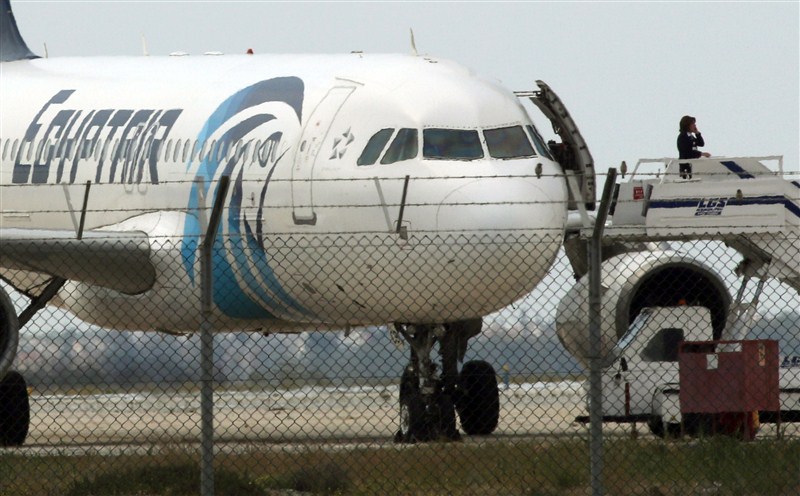 A man thought to be strapped with explosives hijacked an Egyptian plane on a flight between Alexandria and Cairo on Tuesday and forced it to land in Cyprus, Egyptian officials said. EgyptAir,EgyptAir plane hijacked,EgyptAir flight MS181,EgyptAir flight hijacked,explosives,Cyprus,EgyptAir plane landed at Larnaca airport,EgyptAir MS181,MS181,Cypriot anti-terrorism