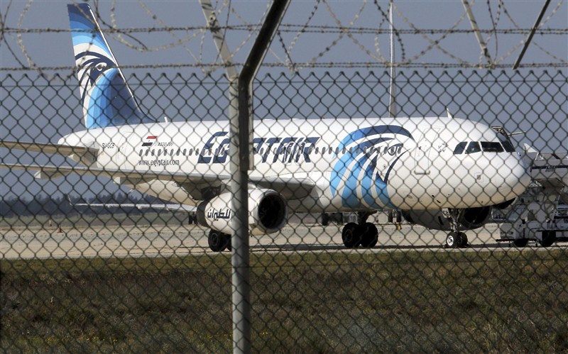 A man thought to be strapped with explosives hijacked an Egyptian plane on a flight between Alexandria and Cairo on Tuesday and forced it to land in Cyprus, Egyptian officials said. EgyptAir,EgyptAir plane hijacked,EgyptAir flight MS181,EgyptAir flight hijacked,explosives,Cyprus,EgyptAir plane landed at Larnaca airport,EgyptAir MS181,MS181,Cypriot anti-terrorism
