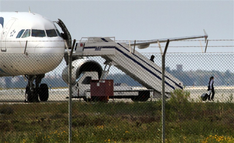 A man thought to be strapped with explosives hijacked an Egyptian plane on a flight between Alexandria and Cairo on Tuesday and forced it to land in Cyprus, Egyptian officials said. EgyptAir,EgyptAir plane hijacked,EgyptAir flight MS181,EgyptAir flight hijacked,explosives,Cyprus,EgyptAir plane landed at Larnaca airport,EgyptAir MS181,MS181,Cypriot anti-terrorism