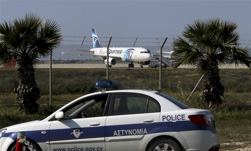 A man thought to be strapped with explosives hijacked an Egyptian plane on a flight between Alexandria and Cairo on Tuesday and forced it to land in Cyprus, Egyptian officials said. EgyptAir,EgyptAir plane hijacked,EgyptAir flight MS181,EgyptAir flight hijacked,explosives,Cyprus,EgyptAir plane landed at Larnaca airport,EgyptAir MS181,MS181,Cypriot anti-terrorism