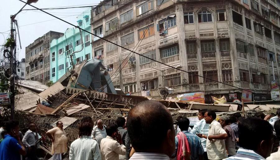 At least 14 people were killed and over 100 injured when a part of a flyover under construction collapsed over taxis and other vehicles in a congested area here on Thursday, police said. Kolkata flyover collapse,Kolkata flyover,Kolkata flyover collapse 14 dead,flyover collapse,flyover collapse in Kolkata,flyover under construction,flyover under construction collapsed