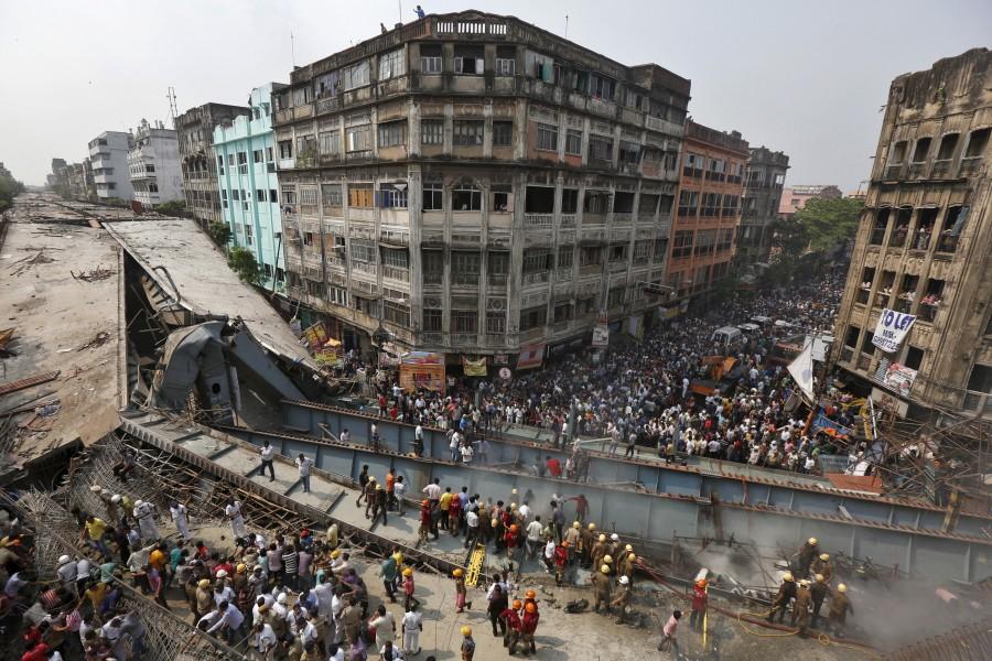 At least 14 people were killed and over 100 injured when a part of a flyover under construction collapsed over taxis and other vehicles in a congested area here on Thursday, police said. Kolkata flyover collapse,Kolkata flyover,Kolkata flyover collapse 14 dead,flyover collapse,flyover collapse in Kolkata,flyover under construction,flyover under construction collapsed