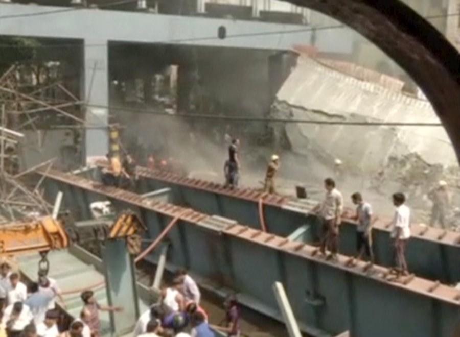 At least 14 people were killed and over 100 injured when a part of a flyover under construction collapsed over taxis and other vehicles in a congested area here on Thursday, police said. Kolkata flyover collapse,Kolkata flyover,Kolkata flyover collapse 14 dead,flyover collapse,flyover collapse in Kolkata,flyover under construction,flyover under construction collapsed