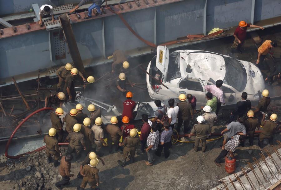 At least 14 people were killed and over 100 injured when a part of a flyover under construction collapsed over taxis and other vehicles in a congested area here on Thursday, police said. Kolkata flyover collapse,Kolkata flyover,Kolkata flyover collapse 14 dead,flyover collapse,flyover collapse in Kolkata,flyover under construction,flyover under construction collapsed