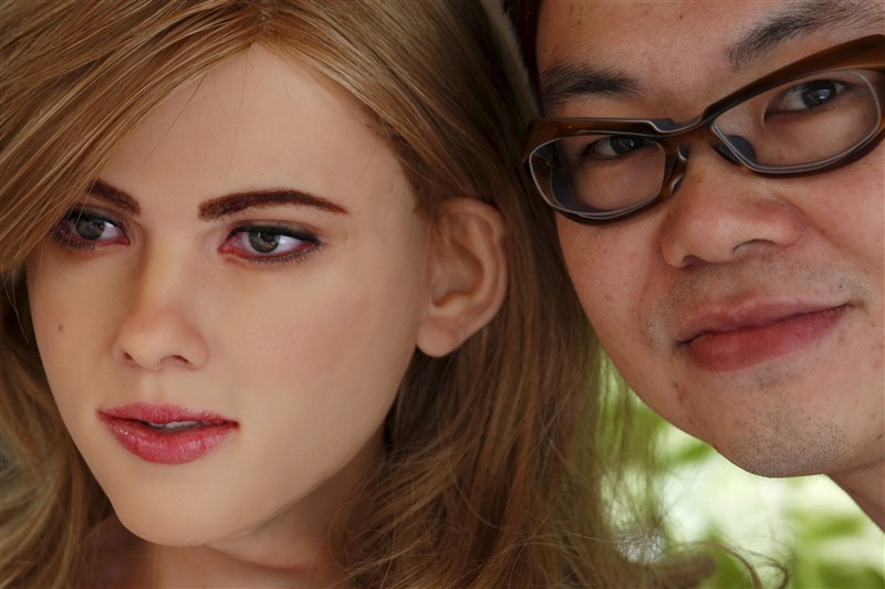 Product and graphic designer Ricky Ma, 42, explains the face and colour tracking functions of his life-size robot 'Mark 1', modelled after a Hollywood star, in Hong Kong, China March 31, 2016. Graphic designer Ricky Ma,Ricky Ma,Mark 1,Mark 1 robot,robot,Hollywood star robot