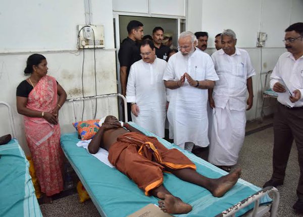 Prime Minister Narendra Modi arrived on Sunday afternoon and along with Chief Minister Oommen Chandy drove to the Puttingal Devi temple in Peravur town. Narendra Modi,Narendra Modi visits Kerala,Narendra Modi visits Kerala temple tragedy site,Modi visits Kerala temple,Puttingal Devi temple,Peravur town,Chief Minister Oommen Chandy,Oommen Chandy,Kerala chief minister oommen chandy