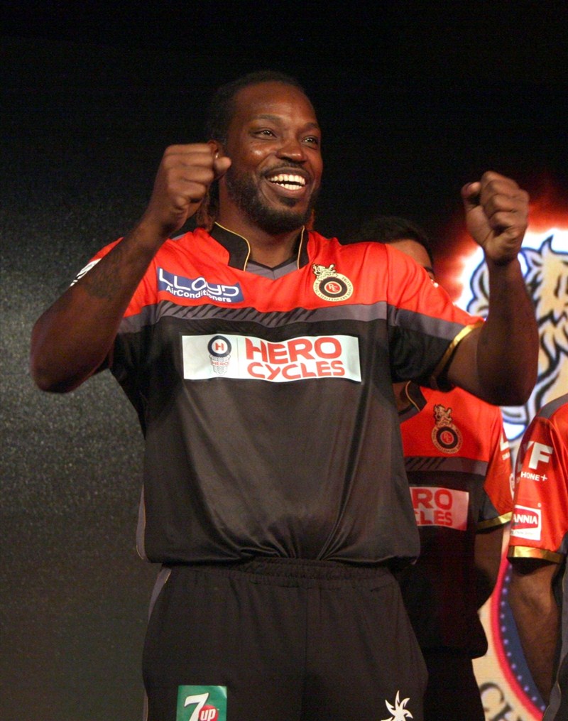 Indian Premier League (IPL) cricket team Royal Challengers Bangalore (RCB) unveiled on Friday an all new black and red jersey with two designs for home and away matches. RCB unveils new jersey,RCB unveils new jersey with two designs,Royal Challengers Bangalore,Royal Challengers Bangalore new jersey,Virat Kohli,Chris Gayle,Virat Kohli and Chris Gayle