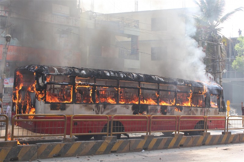 A massive strike on Tuesday by thousands of garment workers over restrictions on withdrawal of provident fund (PF) turned violent in Bengaluru, leading to burning of buses, as police caned and arrested many of them. Bengaluru,Bengaluru violent,PF withdrawal,provident fund,garment workers,Bengaluru Riot Over New Provident Fund Rules