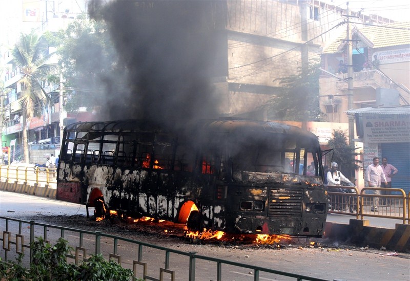 A massive strike on Tuesday by thousands of garment workers over restrictions on withdrawal of provident fund (PF) turned violent in Bengaluru, leading to burning of buses, as police caned and arrested many of them. Bengaluru,Bengaluru violent,PF withdrawal,provident fund,garment workers,Bengaluru Riot Over New Provident Fund Rules