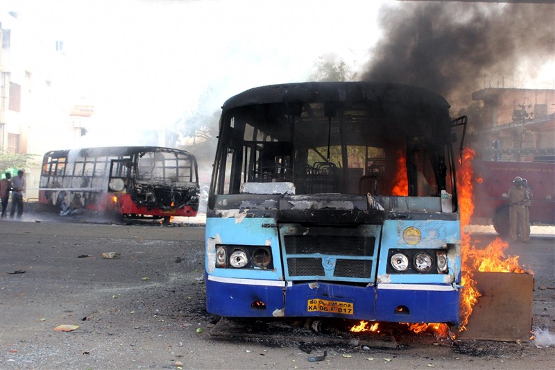 A massive strike on Tuesday by thousands of garment workers over restrictions on withdrawal of provident fund (PF) turned violent in Bengaluru, leading to burning of buses, as police caned and arrested many of them. Bengaluru,Bengaluru violent,PF withdrawal,provident fund,garment workers,Bengaluru Riot Over New Provident Fund Rules