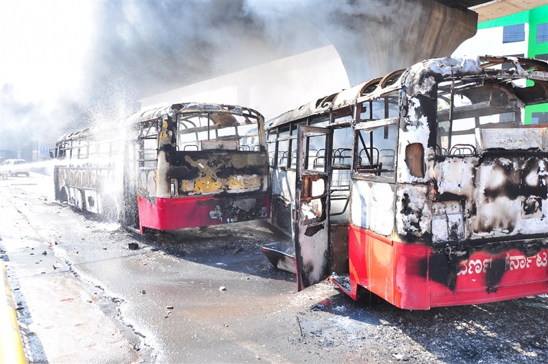 A massive strike on Tuesday by thousands of garment workers over restrictions on withdrawal of provident fund (PF) turned violent in Bengaluru, leading to burning of buses, as police caned and arrested many of them. Bengaluru,Bengaluru violent,PF withdrawal,provident fund,garment workers,Bengaluru Riot Over New Provident Fund Rules