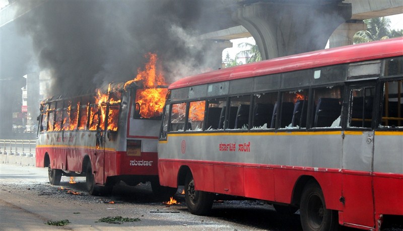 A massive strike on Tuesday by thousands of garment workers over restrictions on withdrawal of provident fund (PF) turned violent in Bengaluru, leading to burning of buses, as police caned and arrested many of them. Bengaluru,Bengaluru violent,PF withdrawal,provident fund,garment workers,Bengaluru Riot Over New Provident Fund Rules