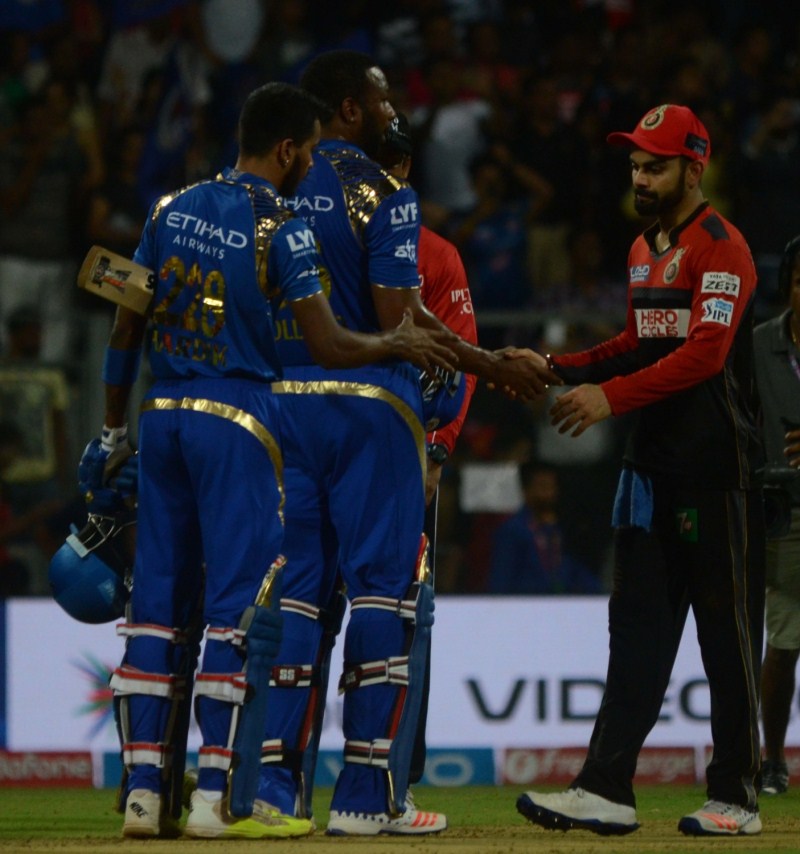 Leading from the front, skipper Rohit Sharma smashed 62 off just 44 balls to guide Mumbai Indians to a comfortable six-wicket victory over Royal Challengers Bangalore in an Indian Premier League (IPL) match at the Wankhede Stadium on Wednesday. Mumbai Indians thrash Bangalore,Mumbai Indians,Rohit Sharma,Royal Challengers Bangalore,Indian Premier League,Indian Premier League 2016,Indian Premier League 9,IPL,IPL 2016,IPL 9