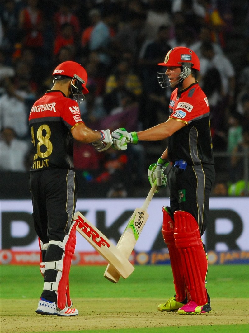 Star batsmen A.B. de Villiers and Virat Kohli smashed quick-fire half-centuries followed by a disciplined bowling effort which guided Royal Challengers Bangalore to a comfortable 13-run victory over Rising Pune Supergiants in an Indian Premier League (IPL) contest on Friday. Royal Challengers Bangalore beat Rising Pune Supergiants,Royal Challengers Bangalore,Rising Pune Supergiants,RPS vs RCB,RPS beat RCB,A.B. de Villiers,Virat Kohli,IPL 2016,IPL 9,IPL,Indian Premier League,Indian Premier League 2016,Indian Premier League 9