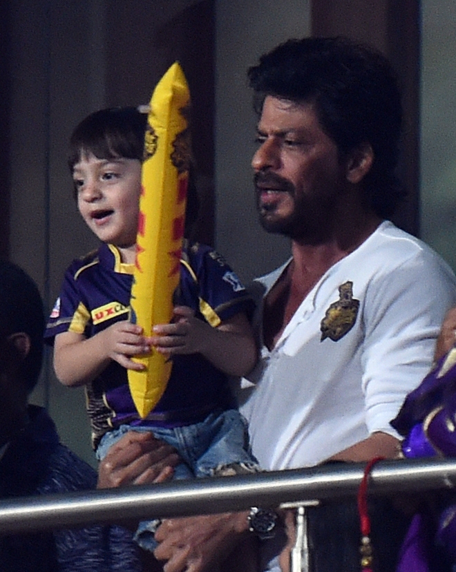 Bollywood star Shahrukh Khan waved and showered flying kisses to fans off the pitch as his team Kolkata Knight Riders (KKR) battled it out against Kings XI Punjab (KXIP) at the Eden Gardens on Wednesday. Shah Rukh Khan,AbRam,Shah Rukh Khan with son AbRam,Shah Rukh Khan and AbRam,Kolkata Knight Riders,Kings XI Punjab,Eden Gardens,Shah Rukh Khan at IPL,Shah Rukh Khan at KKR match